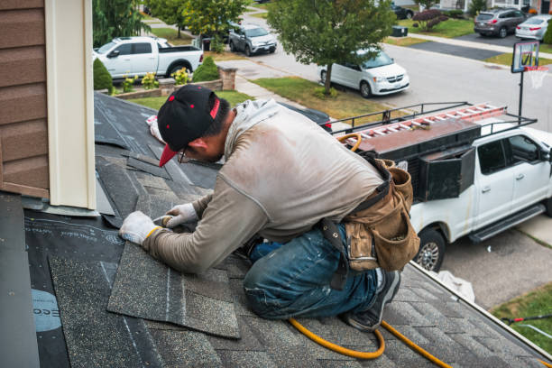 Professional Roof Replacement technician working in Taunton, MA